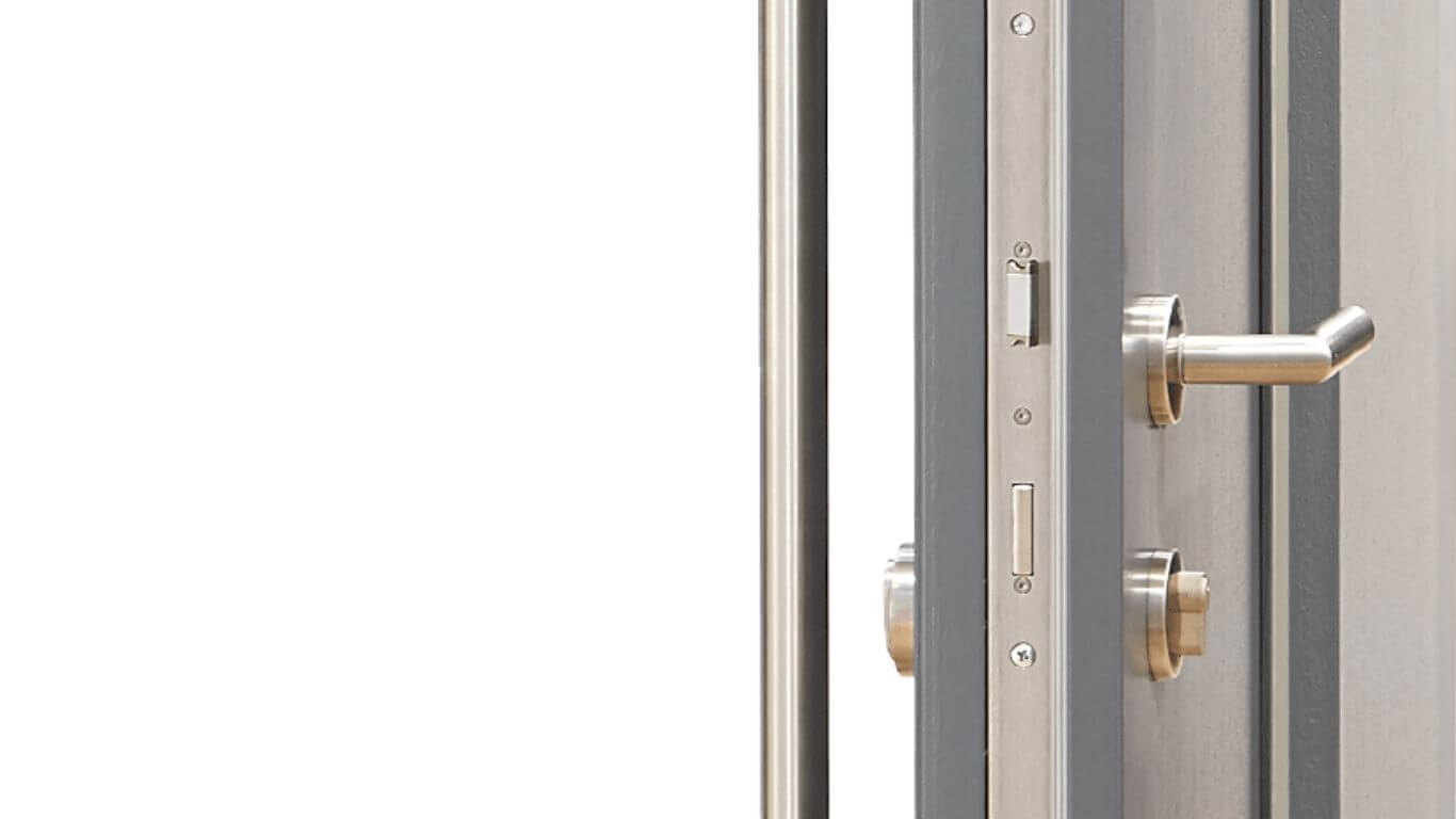 Multipoint lock and lever on a door edge, seen from inside