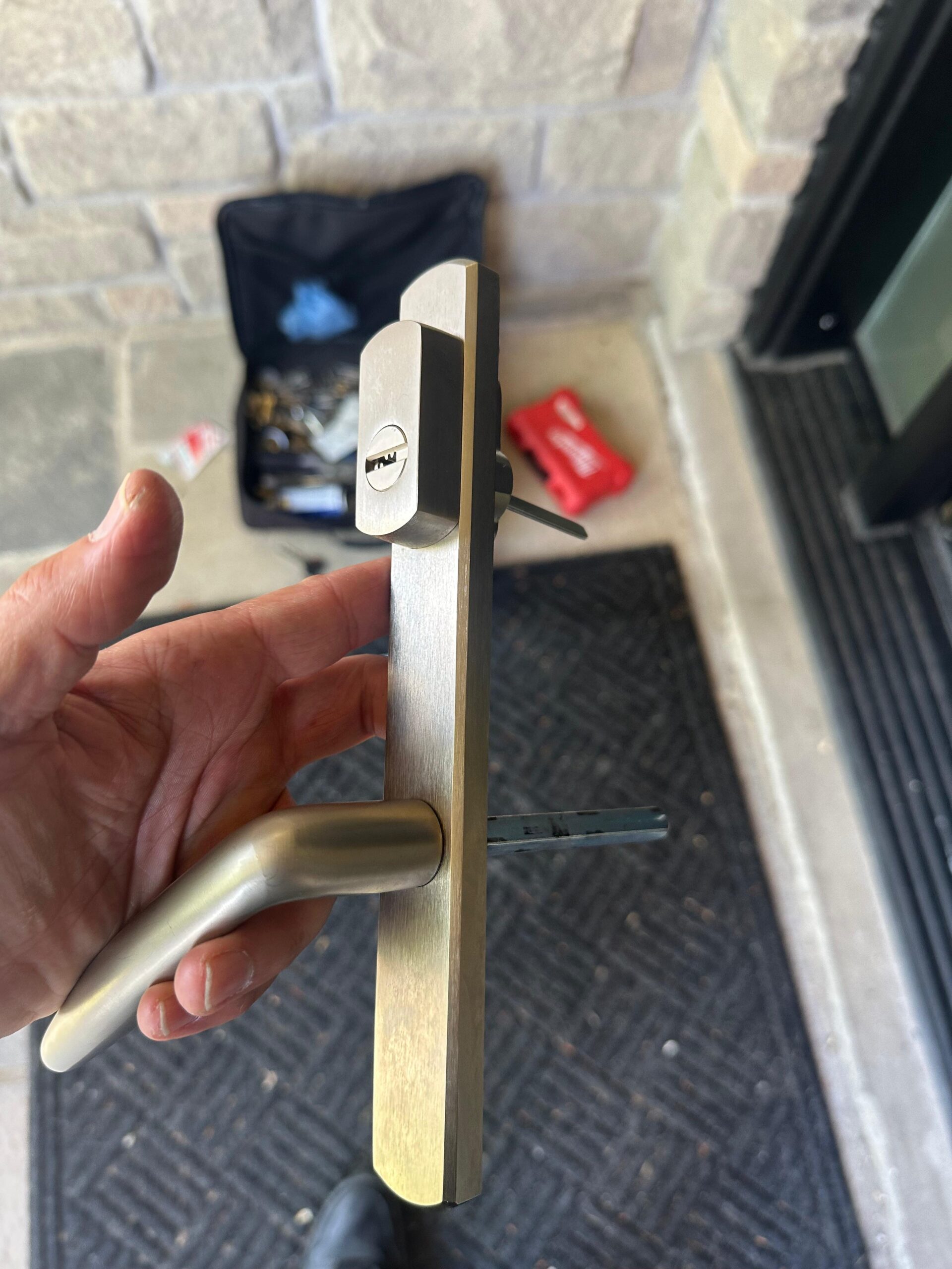 Locksmith rekeying deadbolt cylinder on eviction day