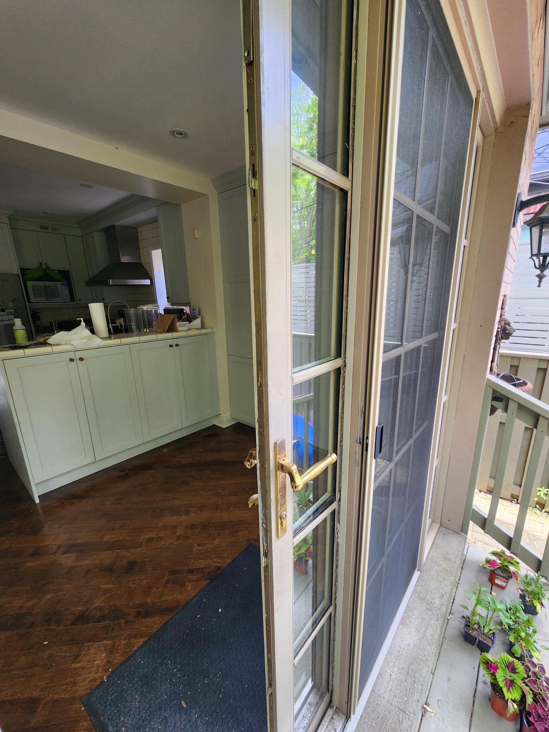 Residential entrance door with a handleset and separate lock hardware