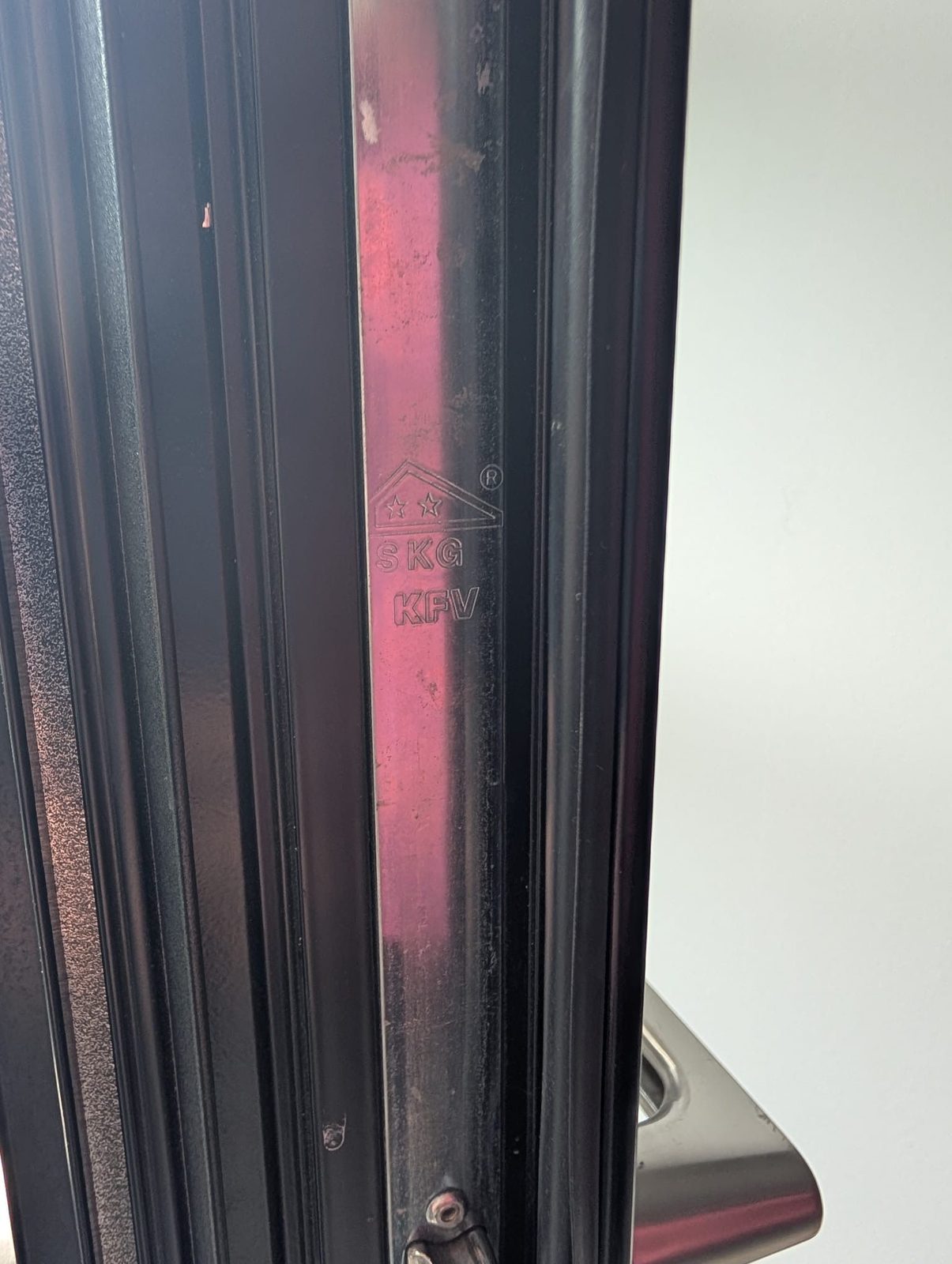 Door edge showing the weather seal between the door and frame