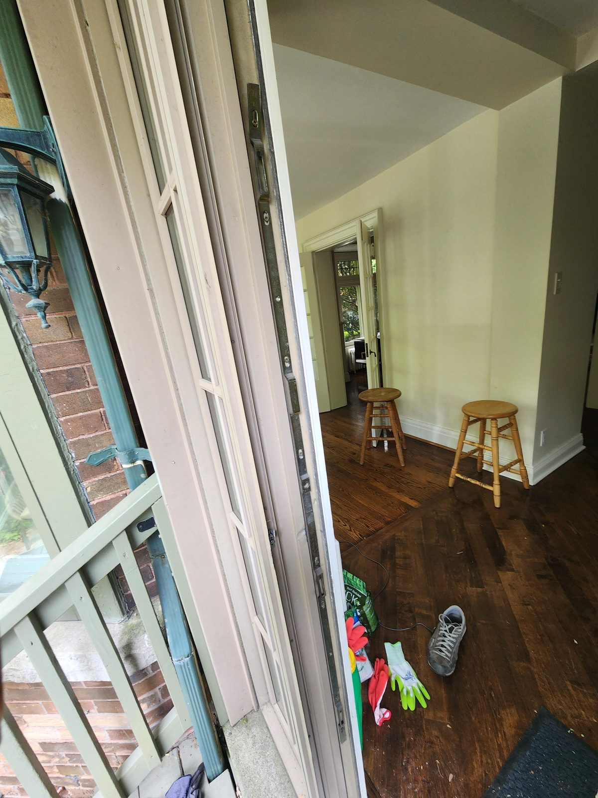 Glazed door standing open onto an interior room