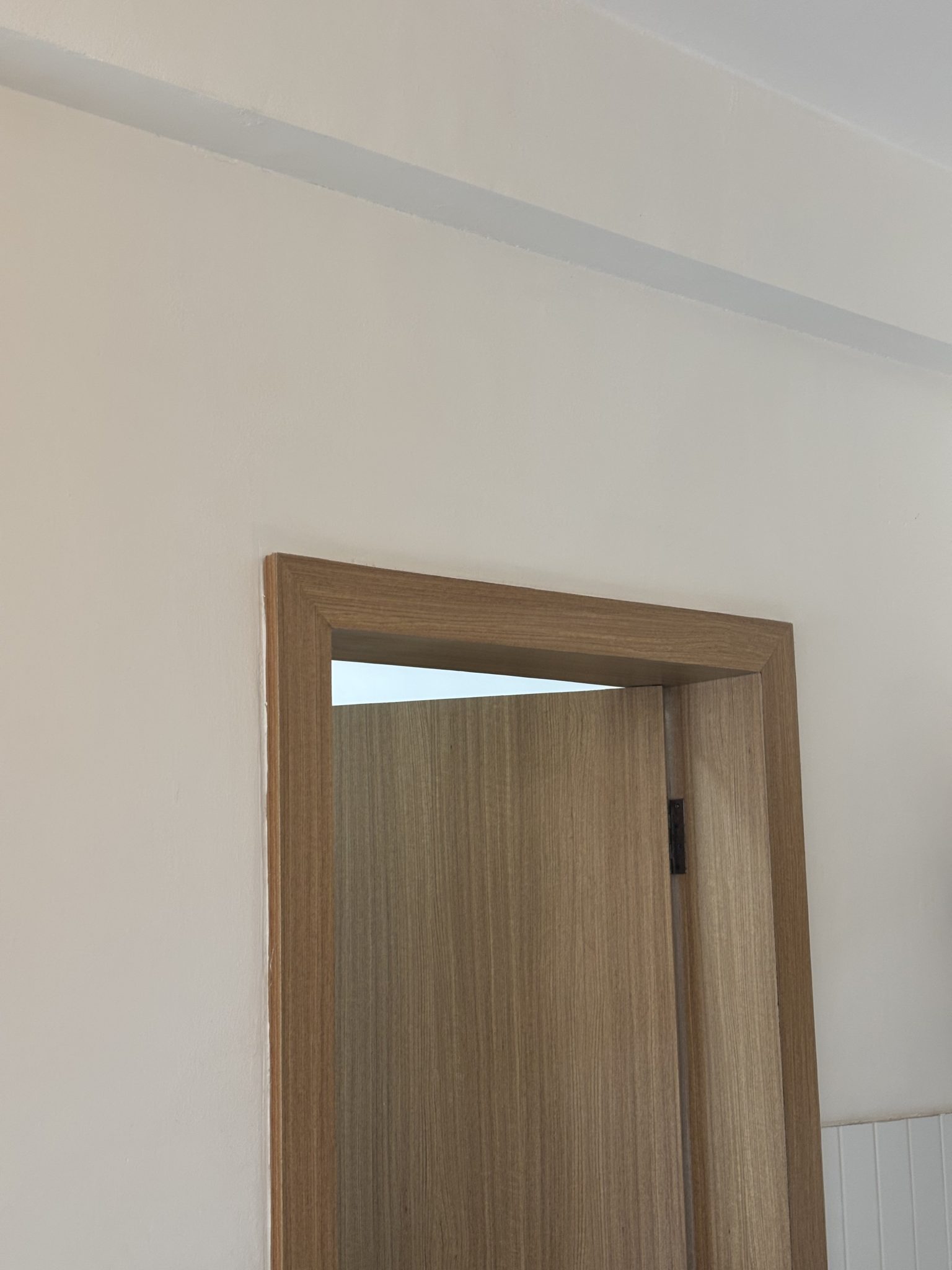 Plain wooden interior door and frame