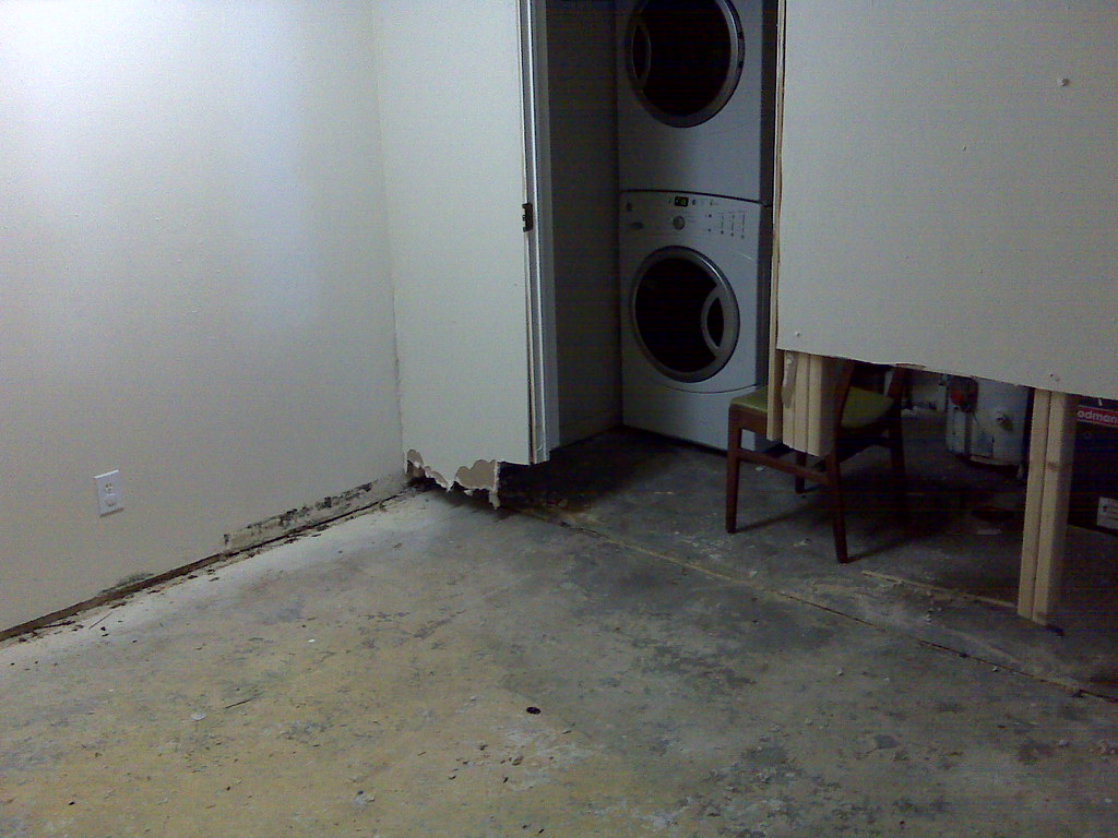 Water-damaged basement room after a flood